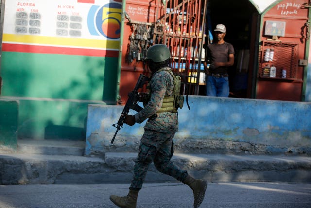 A soldier patrols the outskirts of the international airport in Port-au-Prince, Haiti 