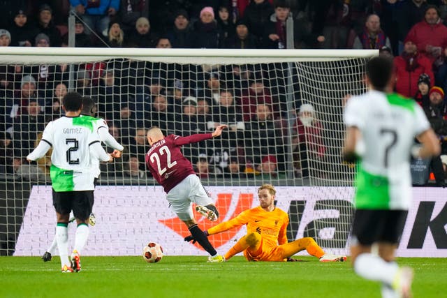 Sparta Prague’s Lukas Haraslin, centre, fails to score after getting past Liverpool’s goalkeeper Caoimhin Kelleher as he is tackled by Ibrahima Konate