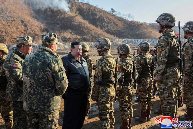 North Korean leader Kim Jong Un meets soldiers