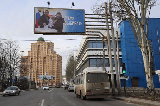 A billboard promoting the upcoming presidential election in a street in the Russian-controlled Donetsk region of eastern Ukraine 