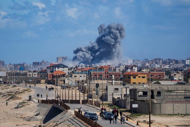 Smoke rises following an Israeli air strike in the central Gaza Strip