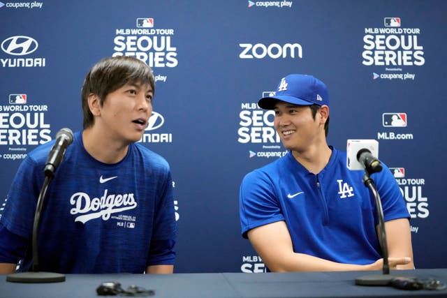 Los Angeles Dodgers’ Shohei Ohtani, right, and his interpreter, Ippei Mizuhara, attend at a news conference ahead of a baseball workout at Gocheok Sky Dome in Seoul, South Korea, on March 16