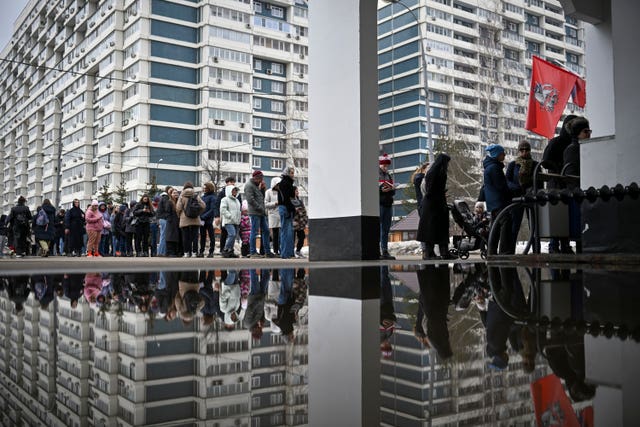 Voters queue at a polling station at noon local time in Moscow, Russia on March 17 (AP Images)