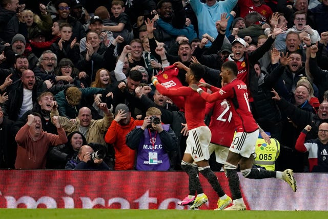 Manchester United’s Amad Diallo, left, celebrates after scoring the winning goal during the FA Cup quarter-final against Liverpool at Old Trafford