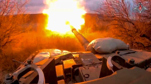 A tank opens fire