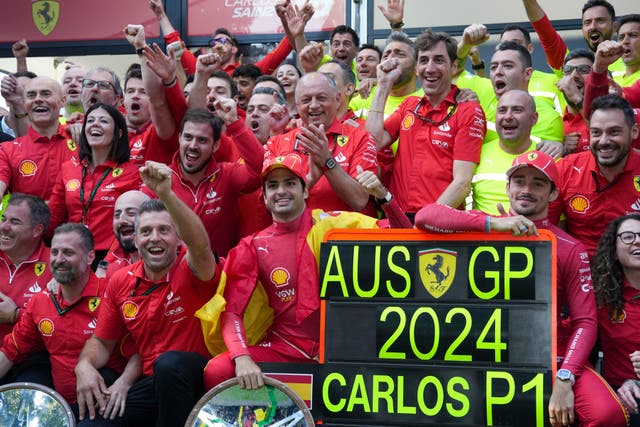 Ferrari team celebrate the race win of Carlos Sainz, centre, of Spain and second placed Charles Leclerc 