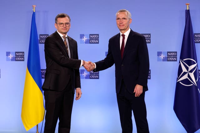 Nato secretary general Jens Stoltenberg, right, shakes hands with Ukraine’s foreign minister Dmytro Kuleba prior to a meeting of the Nato-Ukraine Council at Nato headquarters in Brussels 