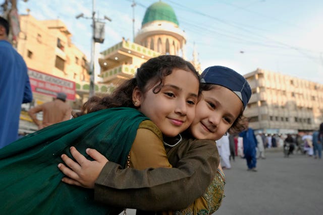 Muslim children share Eid greetings in Karachi, Pakistan