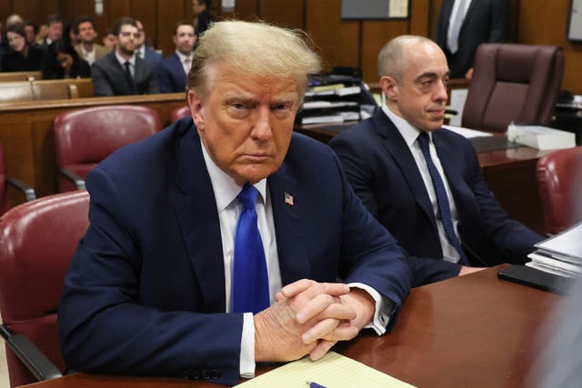 Donald Trump sits in the courtroom 