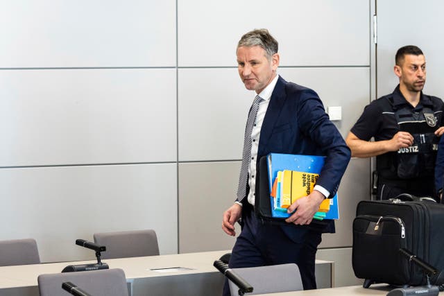 Bjorn Hocke arrives for a session of his trial in court in Halle, eastern Germany