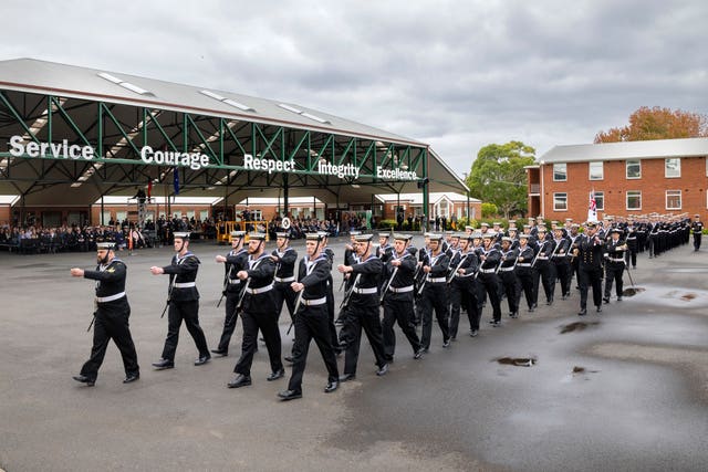 Australian recruits march on to the parade ground during their graduation ceremony