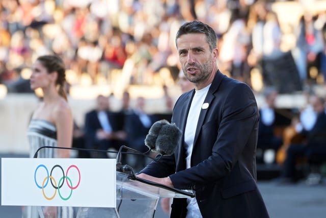 Tony Estanguet, president of Paris 2024, delivers a speech during the Olympic flame handover ceremony at Panathenaic stadium in Athens