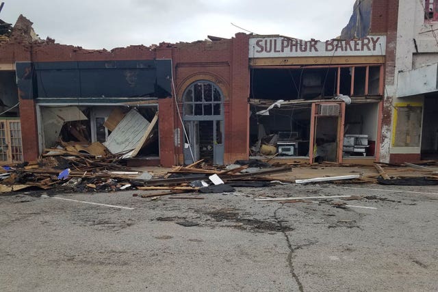 A row of buildings damaged by a tornado in Sulphur 