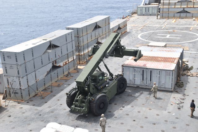 Soldiers assigned to the 7th Transportation Brigade (Expeditionary) and sailors attached to the MV Roy P Benavidez assemble the roll-on, roll-off distribution facility, or floating pier, off the shore of Gaza in the Mediterranean Sea