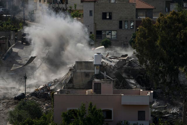 Smoke rises following an explosion during an Israeli military raid in the town of Deir al-Ghusun, near the West Bank town of Tulkarem