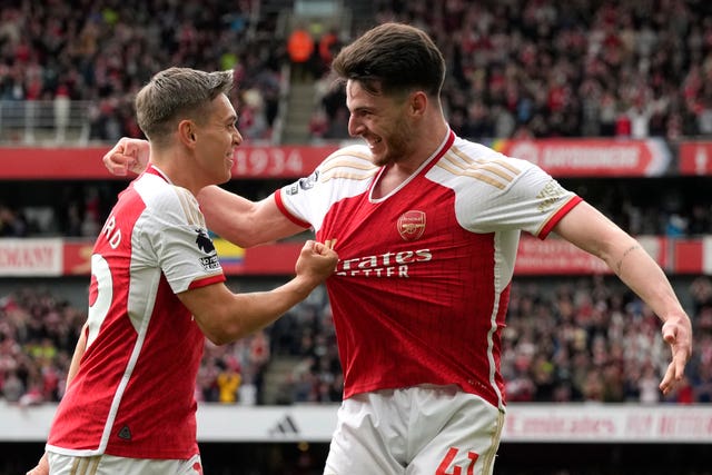 Arsenal’s Leandro Trossard (left) celebrates with Declan Rice after scoring the second goal in the win over Bournemouth