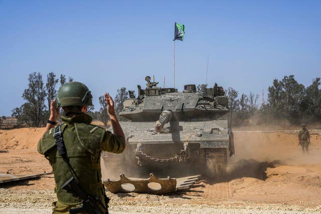 Israeli tanks being directed