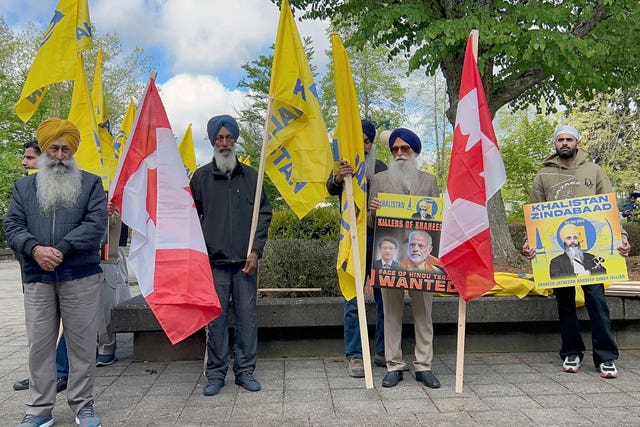 Members of British Columbia’s Sikh community gather in front of the courthouse in Surrey, British Columbia 