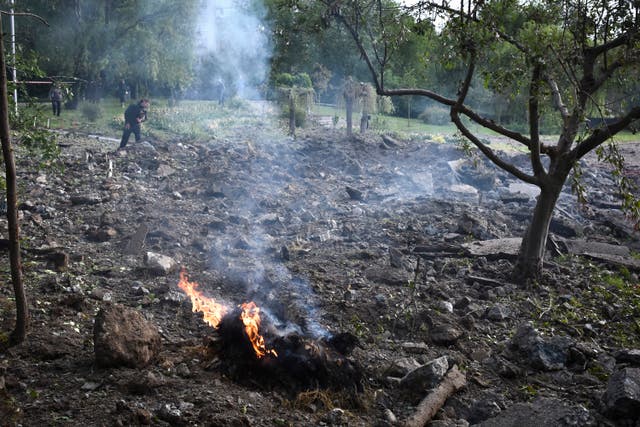 Flames burn in a crater following a Russian missile attack in Zaporizhzhia, Ukraine