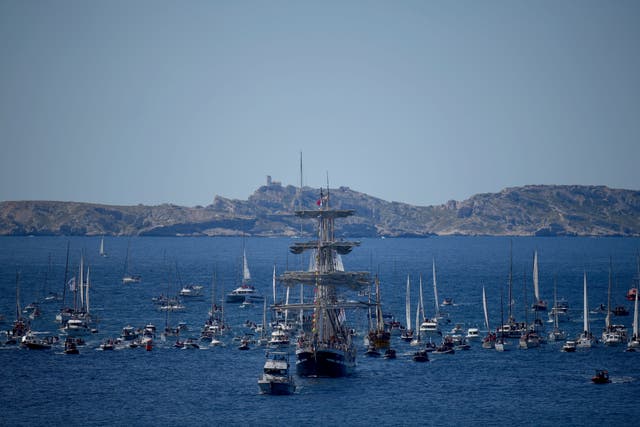 The Belem, the three-masted sailing ship which is carrying the Olympic flame, is accompanied by other boats approaching Marseille, southern France 