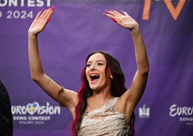 Eden Golan representing Israel greets during a press meeting with the entries that qualified for the final after the second semi-final of the Eurovision Song Contest 