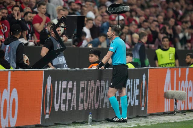 Dutch referee Danny Makkelie checks the VAR monitor 