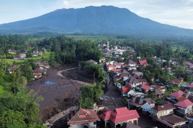 This drone photo shows the damage at a village affected by a flash flood in Tanah Datar, West Sumatra, Indonesia
