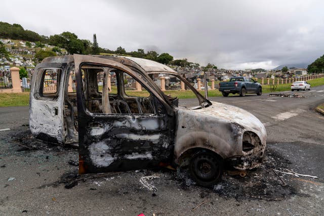 The remains of a car after unrest in Noumea, New Caledonia