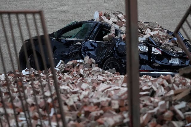 A car damaged by fallen bricks