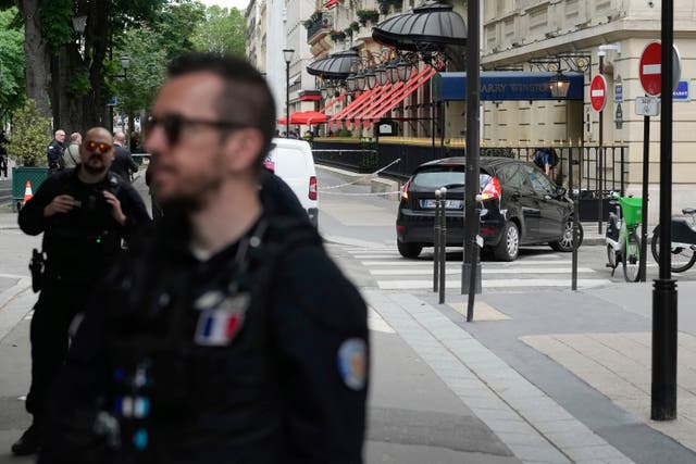 Police officers at the scene of the robbery in Paris