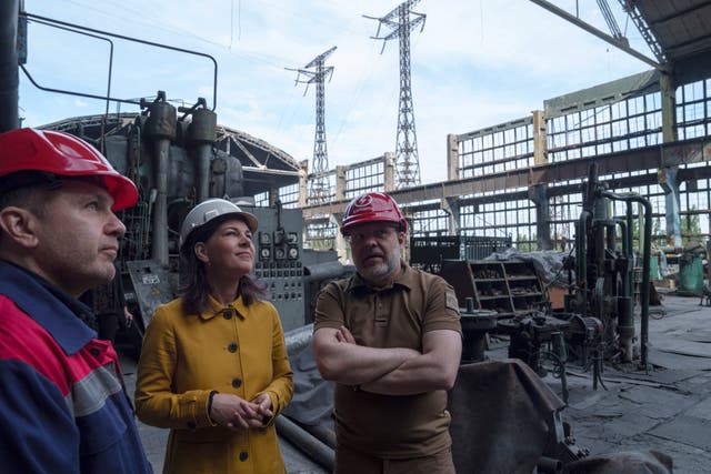 German foreign minister Annalena Baerbock speaks to Ukrainian energy minister Herman Halushchenko during an official visit to a thermal power plant which was destroyed by a Russian rocket attack in Ukraine 