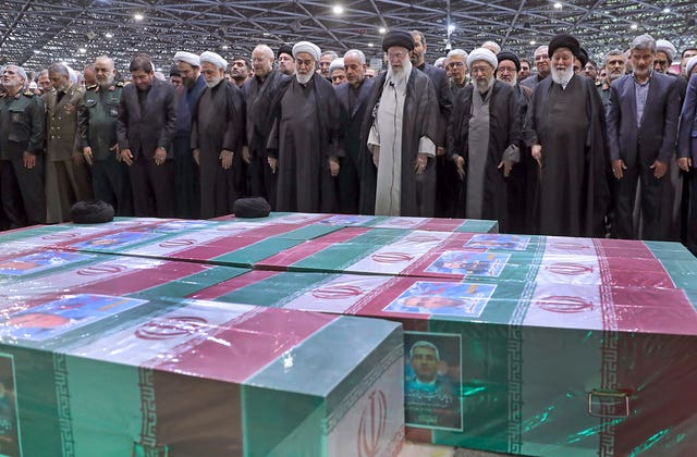 Supreme Leader Ayatollah Ali Khamenei, centre right with black turban, leads a prayer over the coffins of Ebrahim Raisi and his companions 
