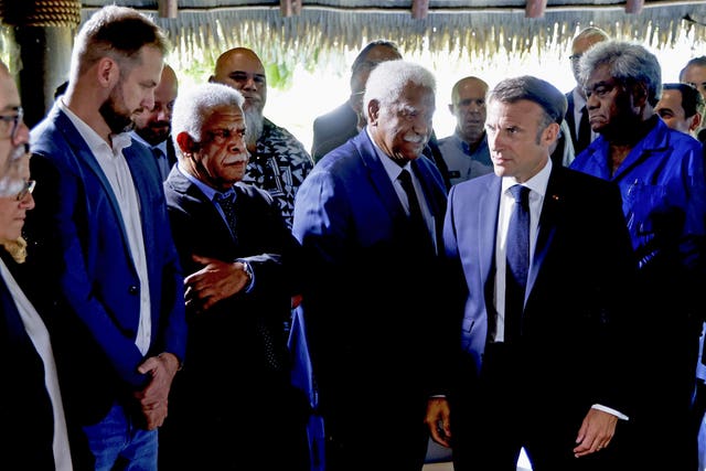 Mr Macron, second right, spoke with New Caledonia’s president Louis Mapou, second left 