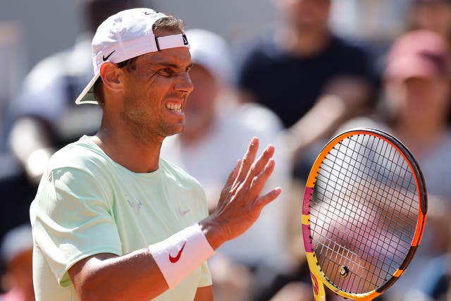 Rafael Nadal reacts during a training session
