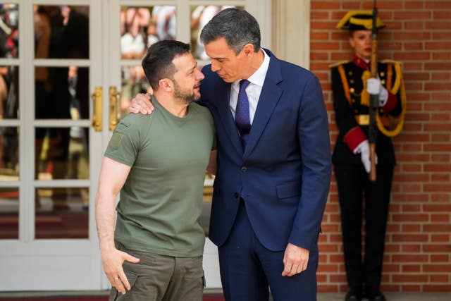 Volodymyr Zelensky, left, is welcomed by Spain’s Pedro Sanchez in Madrid