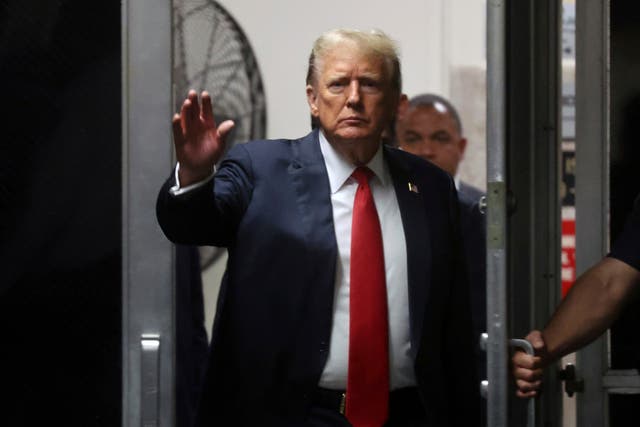 Former US president Donald Trump arrives after a lunch break during closing arguments in his criminal hush money trial at Manhattan Criminal Court in New York 