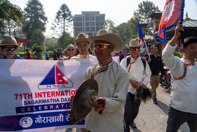 People from the mountaineering community participate in a rally to mark the anniversary of the first ascent of Mount Everest in Kathmandu, Nepal 
