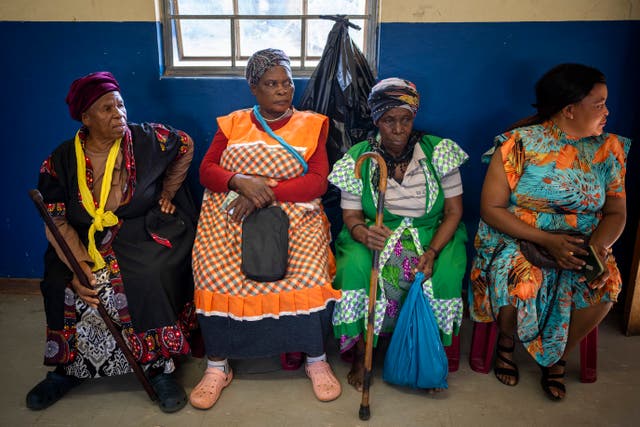 Women wait to cast their ballots during general elections in Nkandla, Kwazulu Natal, South Africa