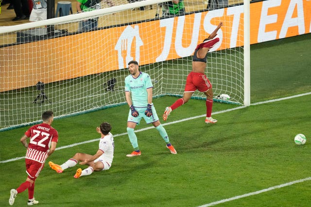 Ayoub El Kaabi, right, celebrates his winner 