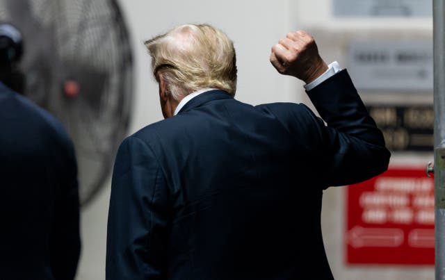 Donald Trump walks out of the courtroom as the jury in his criminal trial continues to deliberate at Manhattan Criminal Court in New York