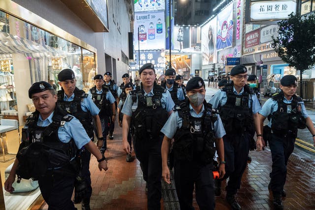 Hong Kong police stand in rows