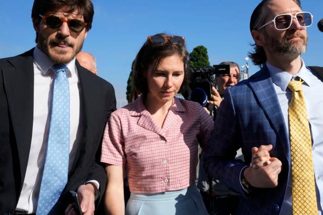 Amanda Knox with her husband Christopher Robinson, right