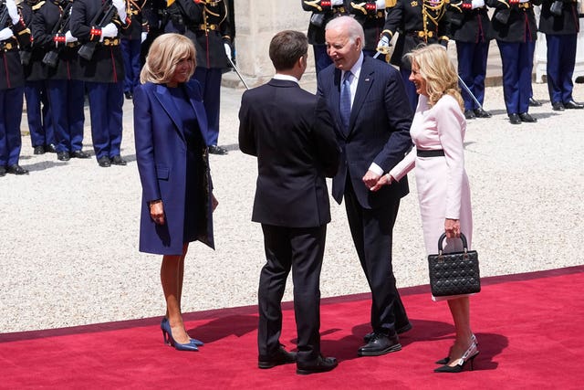 The Macrons greet the Bidens on the red carpet