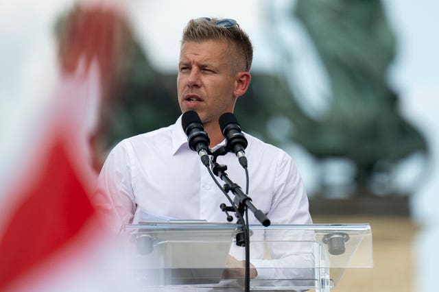 Peter Magyar makes a speech from a lectern