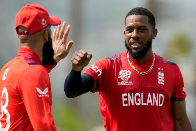 Chris Jordan celebrates with Moeen Ali the dismissal of Australia’s Marcus Stoinis