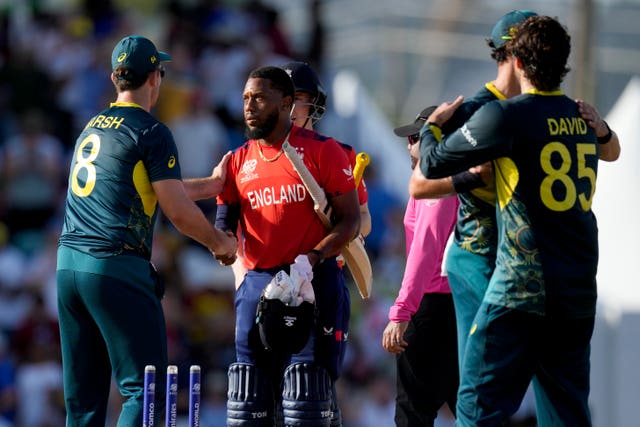 Australia players shake hands with England's Chris Jordan after winning the game