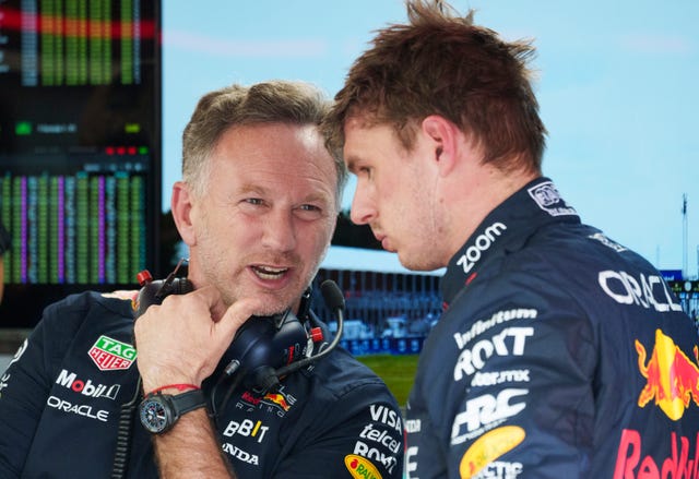 Red Bull team principal Christian Horner chats with Max Verstappen