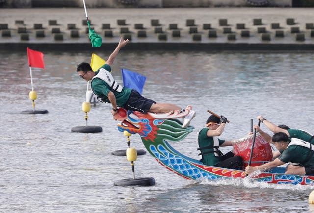 A photo finish on the line at a dragon boat race