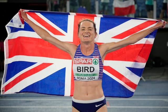 Lizzie Bird holds the British flag