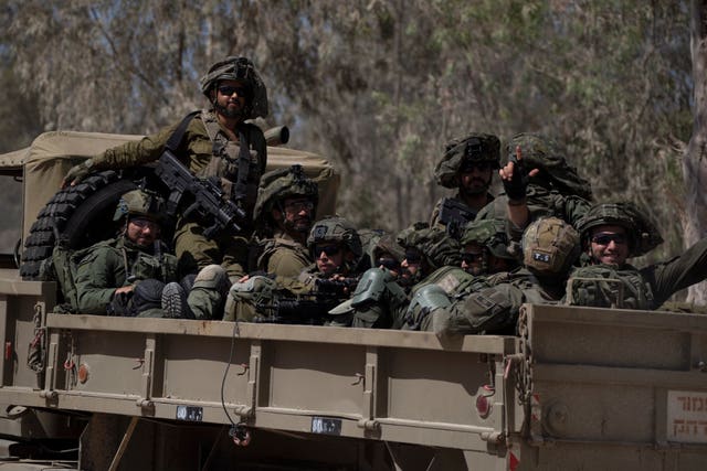 Israeli soldiers on the back of a truck